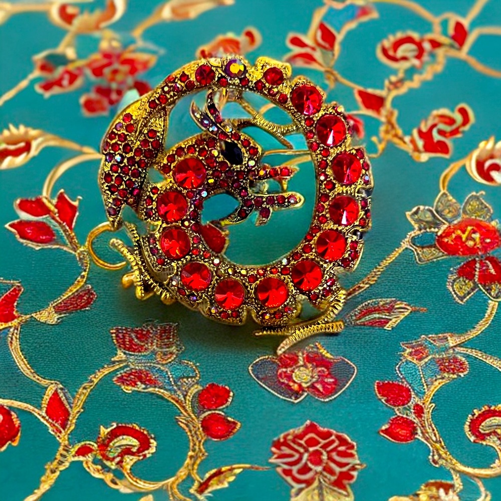 Red dragon, brooch, and pendant